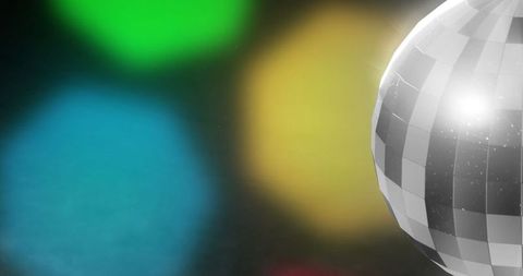 Reflective Disco Ball Casting Colorful Bokeh in Vibrant Night Club Setting