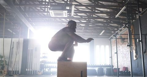 Solid Box Jump Workout in Modern CrossFit Gym, Boosting Fitness and Agility