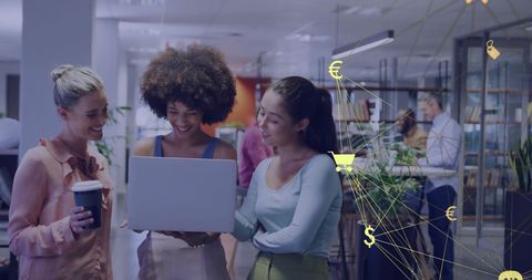 Diverse Female Professionals Engaging with Digital Technology in Modern Office