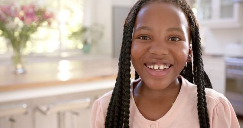 Smiling African American Girl with Braids at Home Kitchen