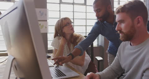 Team Collaboration at Creative Workspace with Focused Discussion
