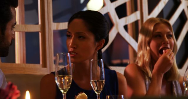 Friends Socializing in Modern Restaurant - Download Free Stock Photos Pikwizard.com