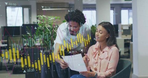 Colleagues Reviewing Report and Analyzing Candlestick and Line Charts in Modern Office