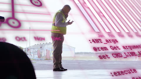 Caucasian Worker and Digital Data Overlay in Industrial Setting