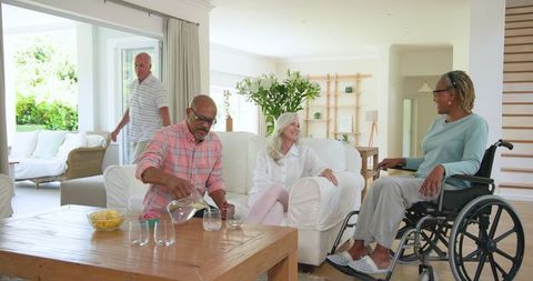 Senior Friends Socializing in Bright Living Room
