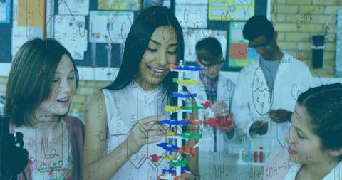 Students engaged in classroom biology dna model exploration