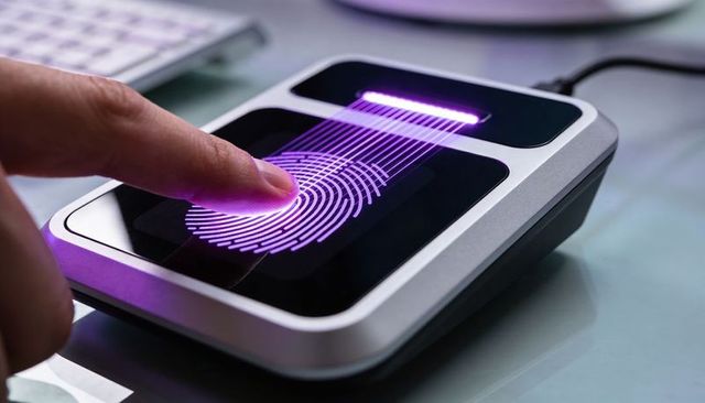 Purple led fingerprint scanner for biometric authentication at workstation