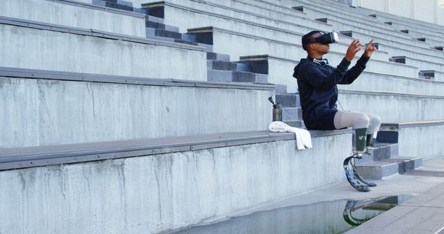 Man With Bionic Leg Using Virtual Reality Glasses in Outdoor Amphitheater - Download Free Stock Images Pikwizard.com