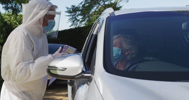 Healthcare Worker Performing Drive-Through COVID-19 Test - Download Free Stock Images Pikwizard.com