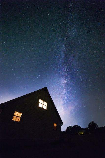 Milky Way Galaxy Over House with Lit Windows - Download Free Stock Photos Pikwizard.com