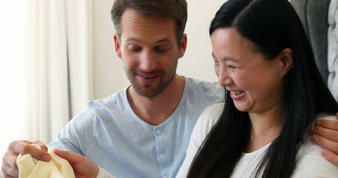 Happy couple anticipating and preparing for new baby arrival