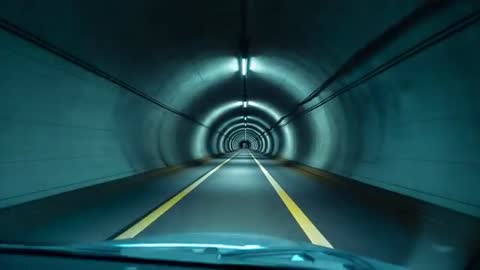 Vehicle Navigating Futuristic Urban Tunnel
