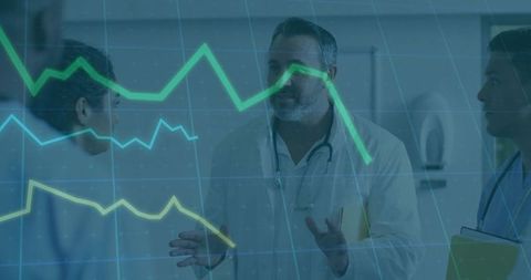 Medical team analyzing patient metrics with dynamic line graphs