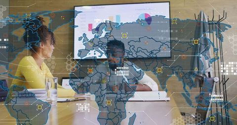 Business team collaborating over world map overlay with data analytics and strategy