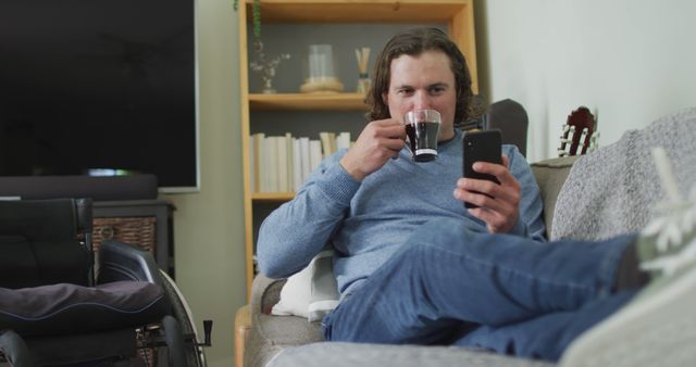 Man Relaxing at Home with Coffee and Smartphone - Download Free Stock Images Pikwizard.com