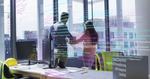 Architects reviewing project plans in modern office space