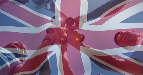 Friends Celebrating with Union Jack Flag Overlay Summer Gathering