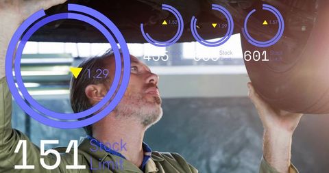 Mechanic inspecting vehicle underbody with augmented reality HUD diagnostics in garage
