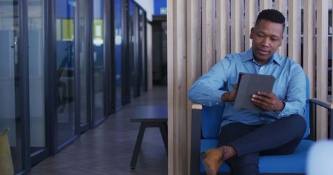 Businessman in office using tablet technology for productivity