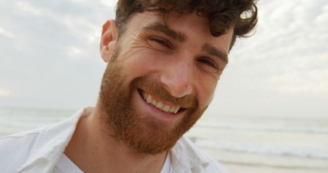 Smiling Man with a Beard Enjoying Beach Day Close-Up - Download Free Stock Images Pikwizard.com