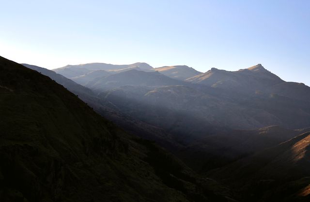 Misty morning mountain range in soft sunlight - Download Free Stock Photos Pikwizard.com