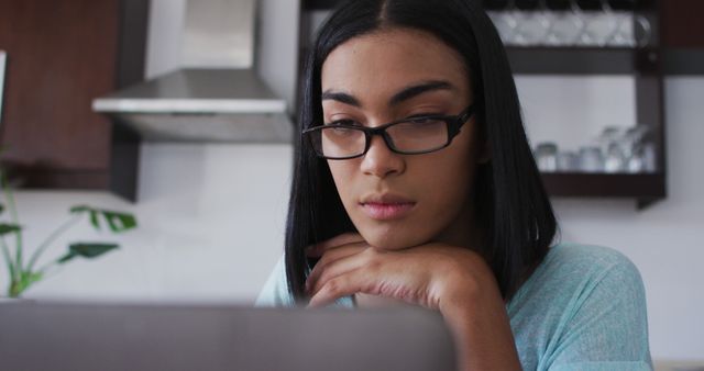 Focused Woman with Glasses Working on Laptop in Modern Kitchen - Download Free Stock Images Pikwizard.com