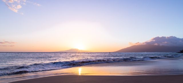 Serene Beach Sunset with Golden Sky and Gentle Waves - Download Free Stock Photos Pikwizard.com