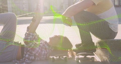Urban Teenage Friendship in Plaza with Skateboards and Sunlight