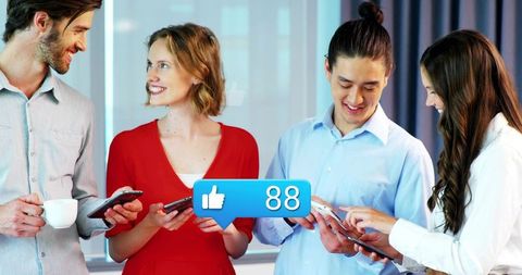 Professionals Engaging with Technology in Modern Office Environment