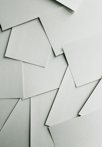 Abstract overlapping white paper sheets background