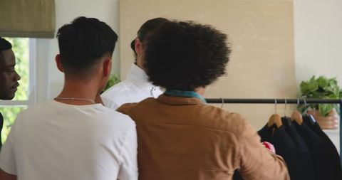 Groom Preparing with Friends: Wedding Day Bonding Moments