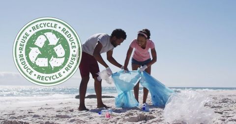 Couple volunteering beach cleanup embracing recycling
