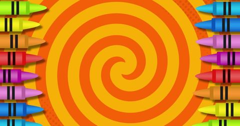Colorful Crayons on Orange and Yellow Spiral Pattern