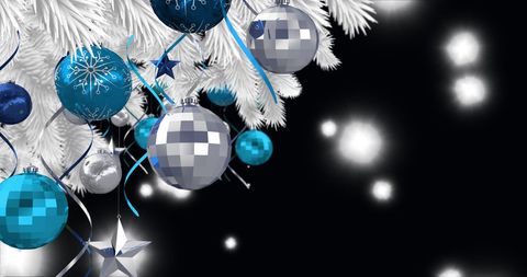 Festive Blue and Silver Baubles on White Christmas Tree