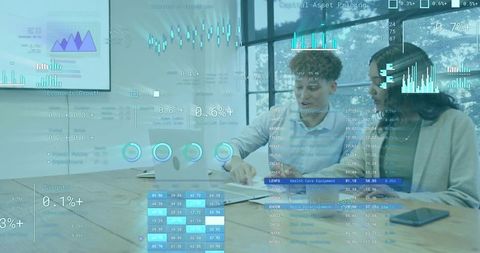 Collaborating over laptop with augmented analytics overlays in modern boardroom meeting