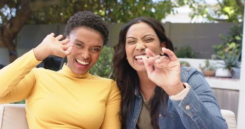 Diverse Female Friends Bonding in Garden