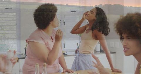 Friends Exploring Wine Aromas Enjoying Charcuterie in Modern Kitchen