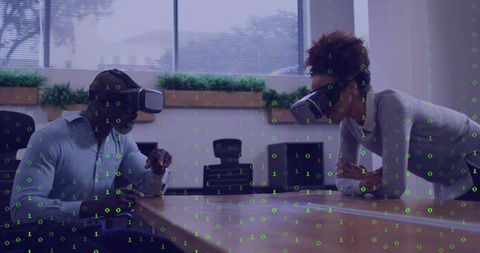 Colleagues exploring virtual collaboration in boardroom using vr headsets and data overlay