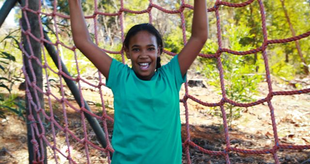 Joyful Girl Playing on Outdoor Rope Climbing Structure - Download Free Stock Images Pikwizard.com