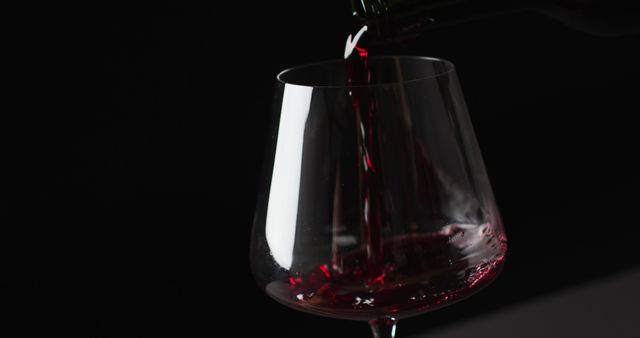 Close-Up of Red Wine Being Poured Into Glass with Dark Background - Download Free Stock Images Pikwizard.com