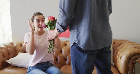 Surprised Woman Receiving Flowers and Gift on Romantic Occasion