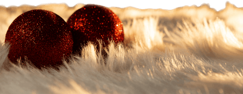 Red christmas balls on white fur with transparent background