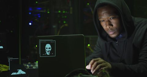 Cybersecurity: Focused Hacker Programming on Laptop in Darkroom - Download Free Stock Images Pikwizard.com