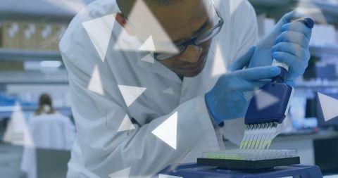 Dedicated scientist using pipette for precision microplate analysis