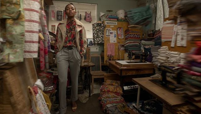 Talented Seamstress in Stylish Atelier Surrounded by Fabrics