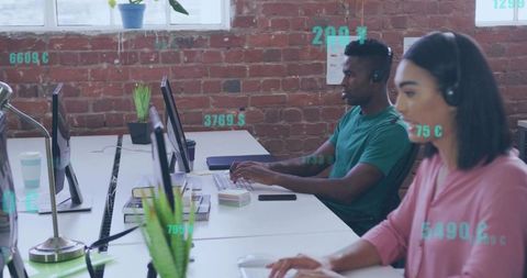 Typing Support Team Collaborating at Open Office with Headsets and Monitors
