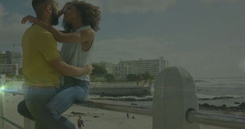 Couple Embracing on Seaside Promenade By Ocean View