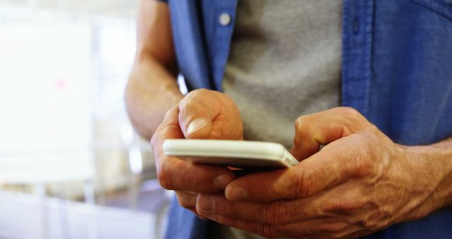 Close-Up of Man Using Smartphone in Casual Outfit - Download Free Stock Images Pikwizard.com