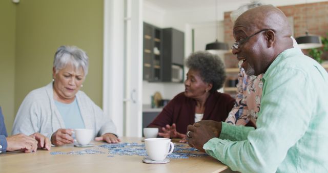 Senior Friends Enjoying Puzzle Game and Coffee Together - Download Free Stock Images Pikwizard.com