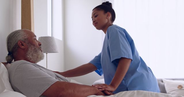 Nurse Assisting Elderly Patient in Hospital Bed - Download Free Stock Images Pikwizard.com